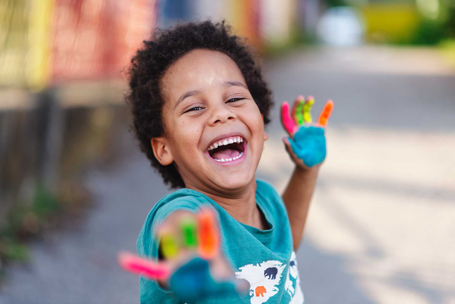 boy with paint on his hands